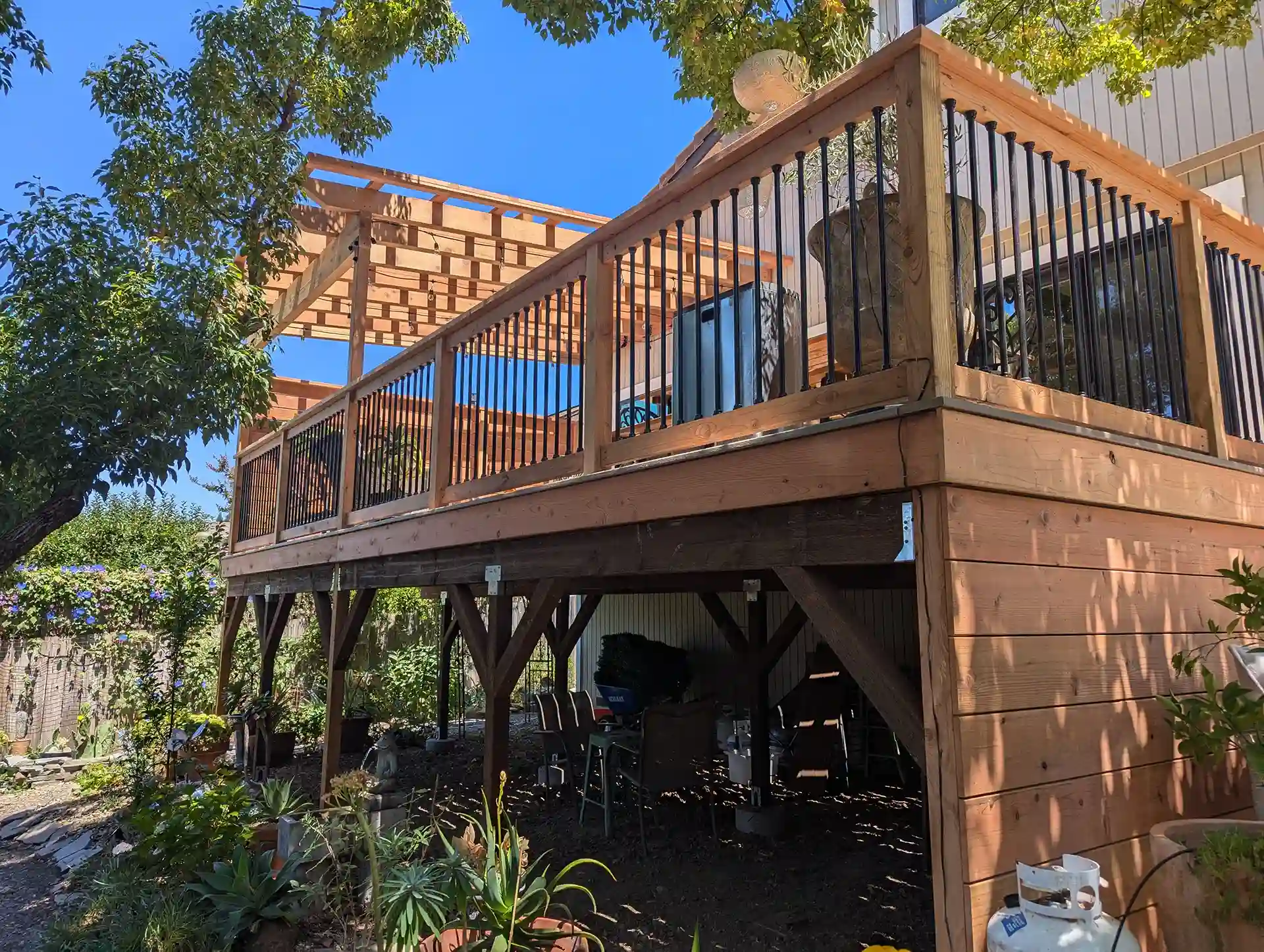 Raised wood deck with exposed framing and under-deck space, ideal for DrySpace waterproofing installation